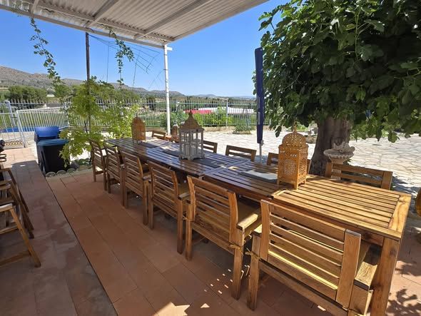 Shaded group dining area with views of the hills